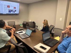 Corporate photographer Bridget Horgan Bell consults with the Wiley Mission Team