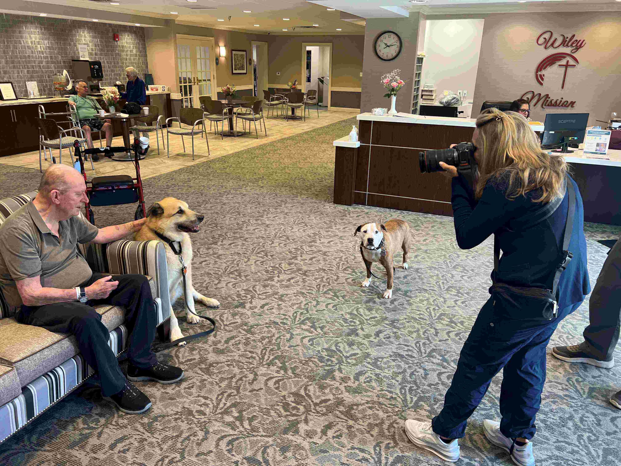 Corporate photographer Bridget Horgan Bell take pictures of residents at Wiley Mission in Marlton